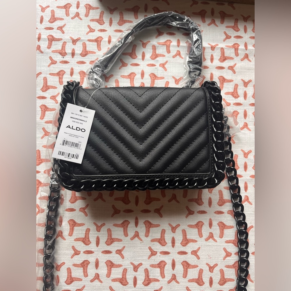 Aldo Mini Greenwald Crossbody Bag. New with Tags. Black Chain Strap.